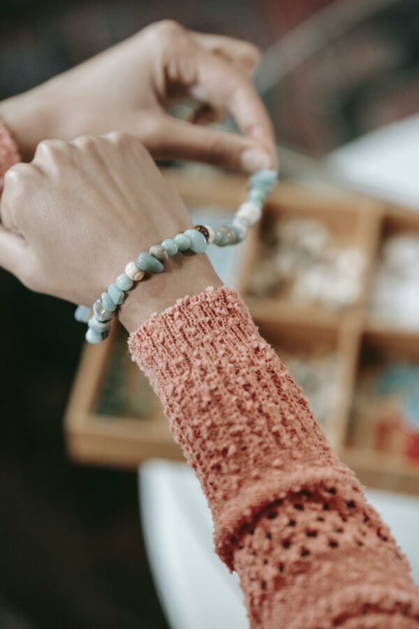 Unrecognizable woman trying on handmade bracelet