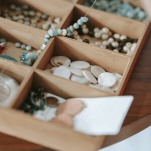 Wooden container with various beads